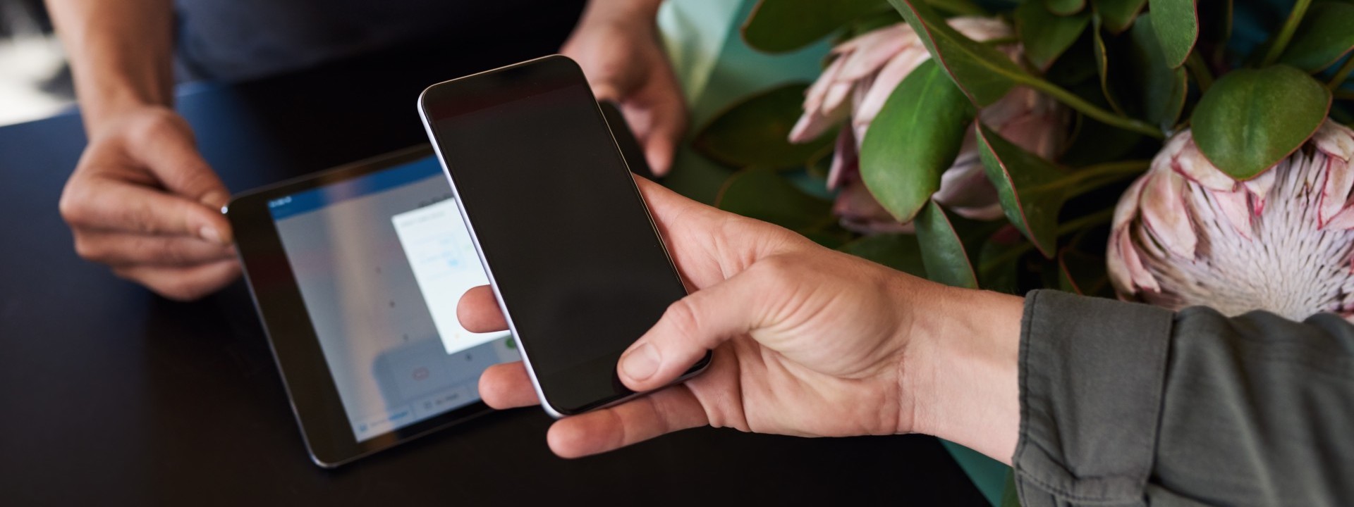 person paying with mobile in a shop